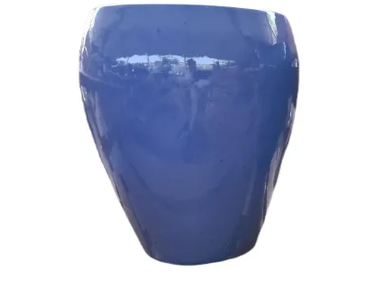 עציץ הולך וצר מגלזורה בצבע טורקיז